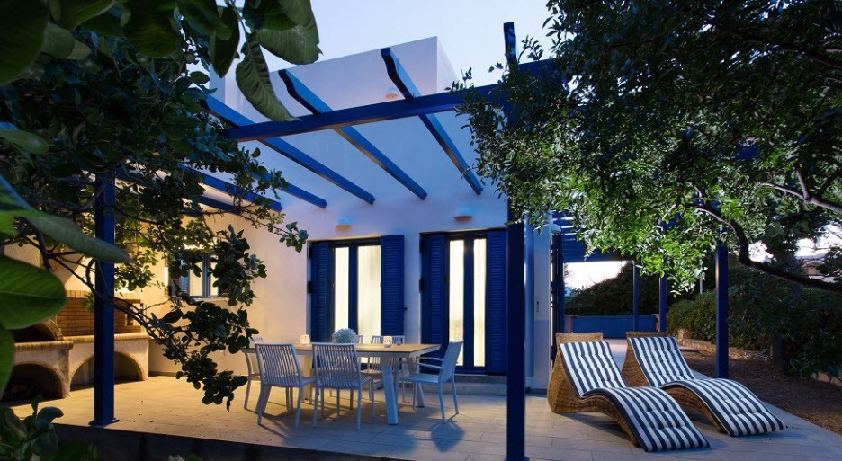 Aneli-Villa-Aegina-Terrace-with-loungers-and-dining-table